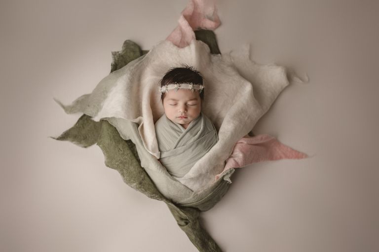 newborn photographed within the first two weeks of life