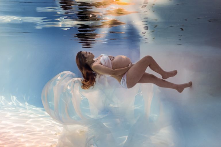 Fine-art underwater maternity photography in Dallas–Fort Worth