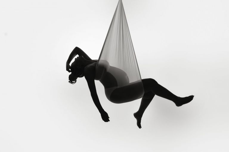 Fine art maternity sling pose with sculptural lighting, luxury maternity photography Flower Mound