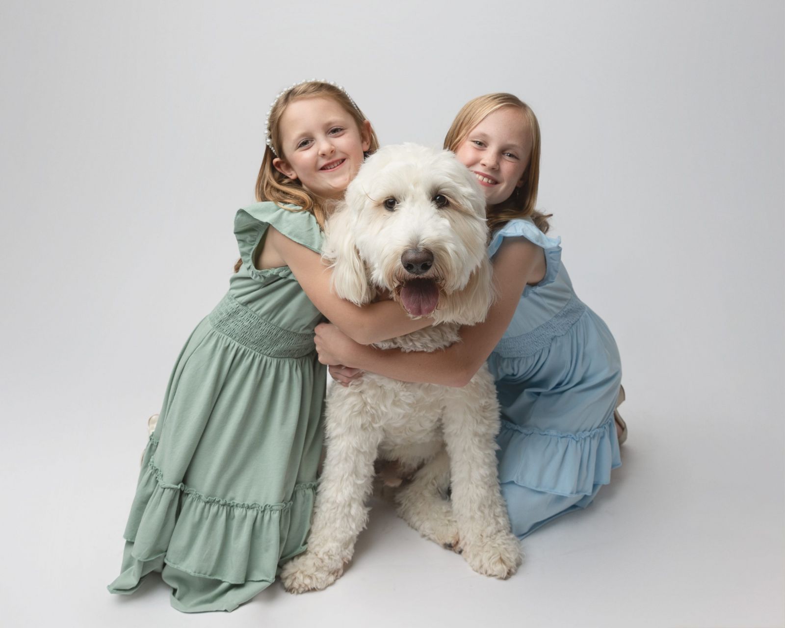 Luxury studio family portrait with dog by Dallas family photographer